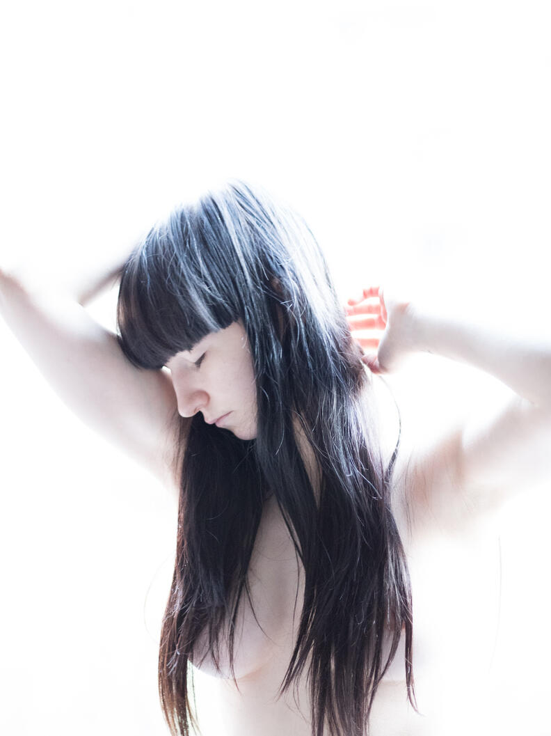 Untitled photograph, girl, interior, natural light, standing